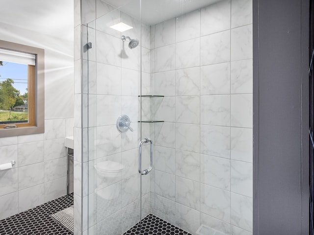 bathroom featuring vanity, toilet, and an enclosed shower