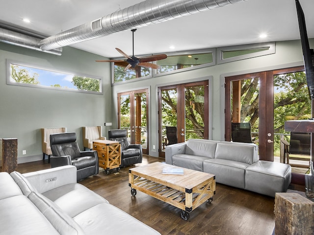 living room featuring ceiling fan, plenty of natural light, dark hardwood / wood-style flooring, and french doors