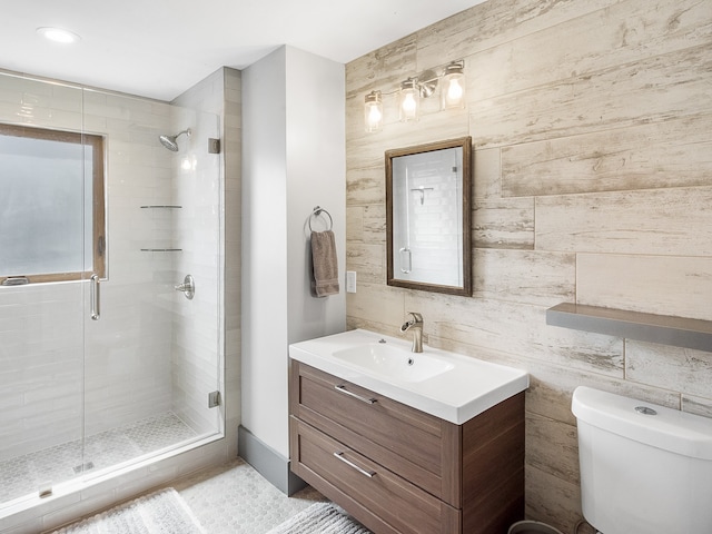 bathroom featuring vanity, toilet, and walk in shower