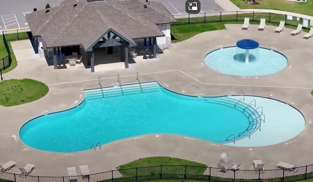 view of swimming pool featuring a patio area