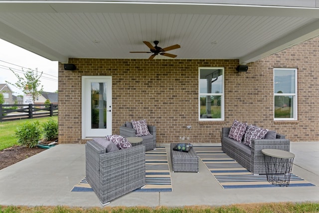 view of patio with ceiling fan and outdoor lounge area