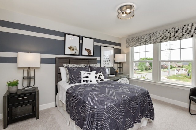 bedroom featuring light colored carpet