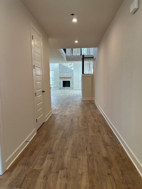 corridor featuring dark hardwood / wood-style floors