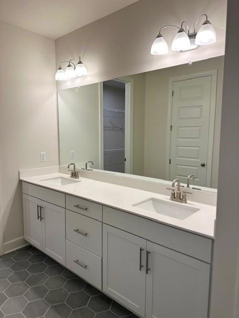 bathroom featuring tile patterned flooring and vanity