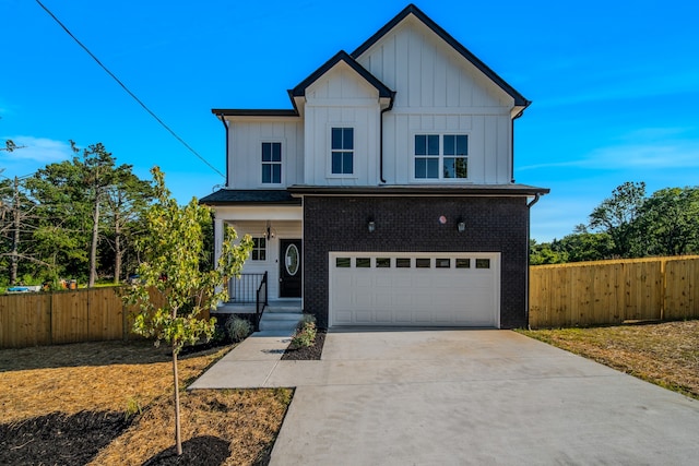 view of front of house with a garage and a porch