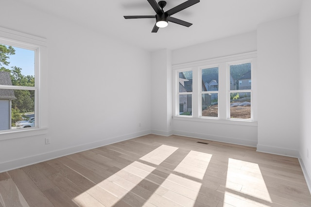 unfurnished room with light hardwood / wood-style floors and ceiling fan