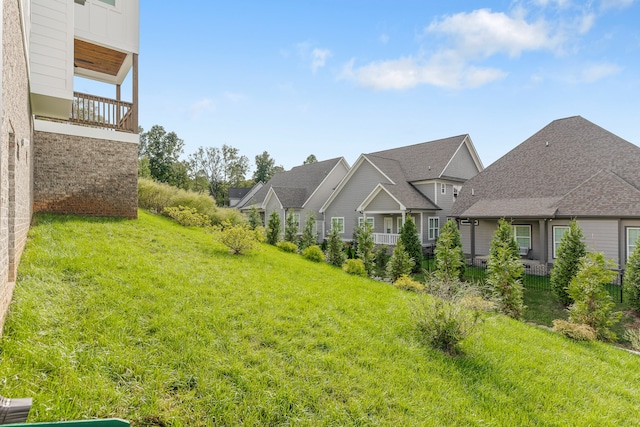 view of yard featuring a balcony