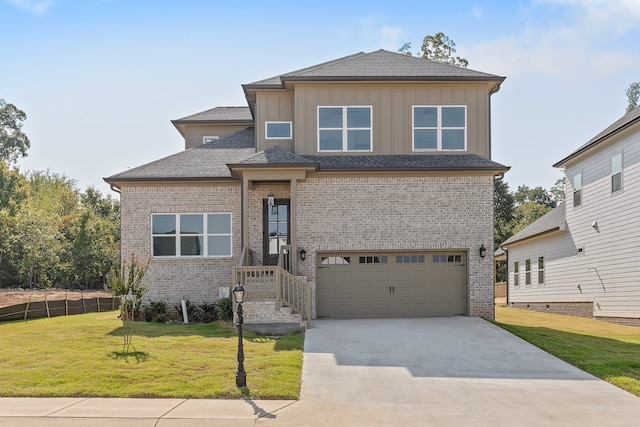 view of front of home featuring a garage and a front yard