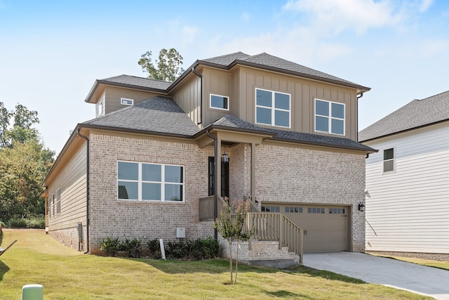 view of front facade with a front yard and a garage