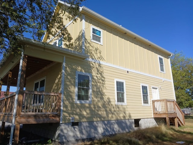 view of side of property with a deck