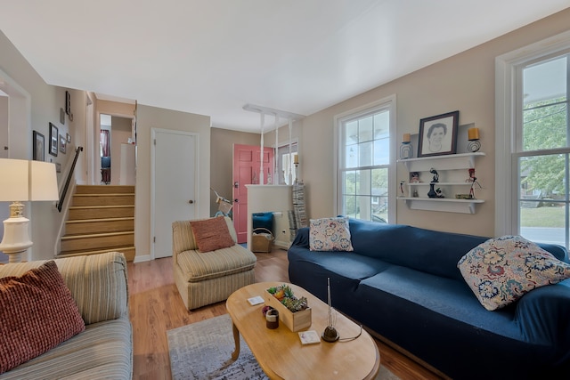 living room featuring light hardwood / wood-style floors and a healthy amount of sunlight