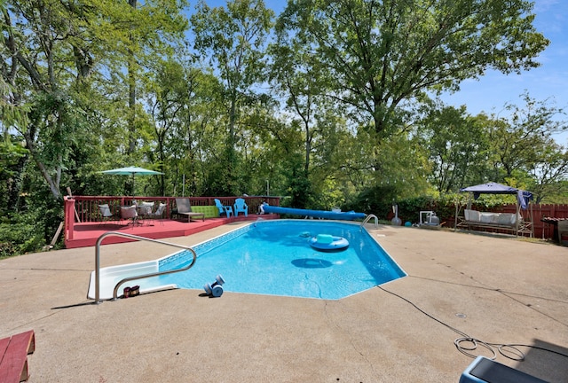 view of swimming pool with a patio area