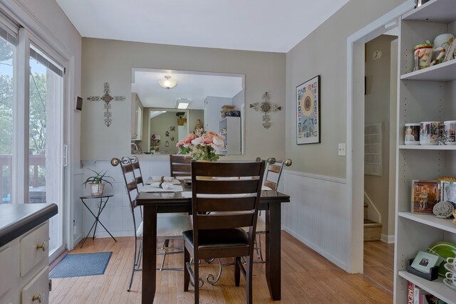 dining space with light wood-type flooring