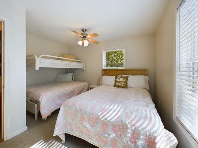 bedroom with ceiling fan and carpet flooring