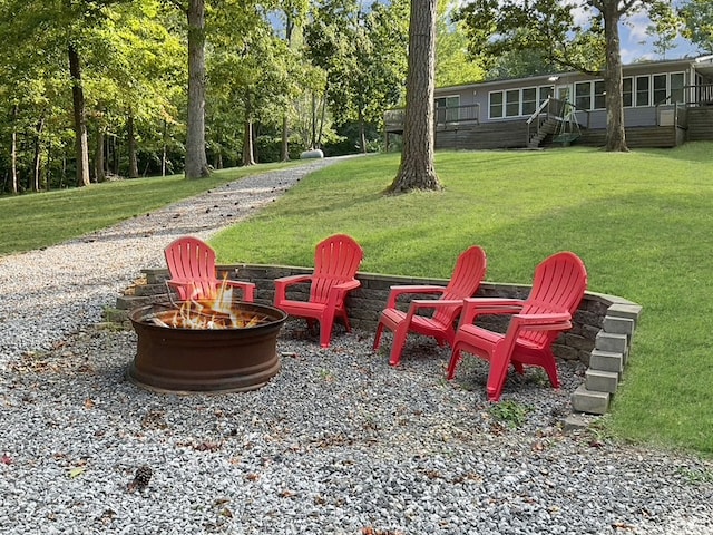 view of yard with a fire pit