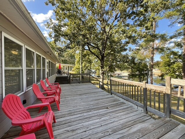 wooden terrace with a water view