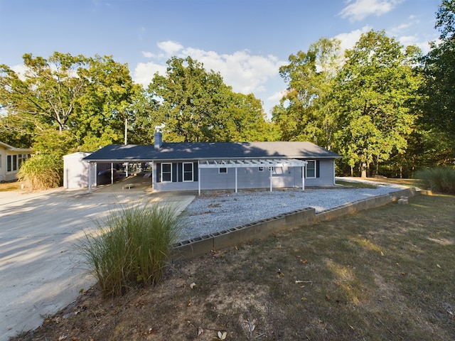 single story home featuring a carport