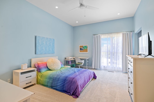 bedroom featuring light carpet and ceiling fan