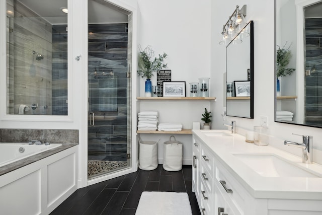 bathroom featuring vanity and separate shower and tub