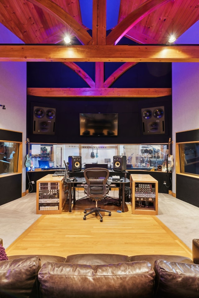 interior space featuring beamed ceiling and hardwood / wood-style floors