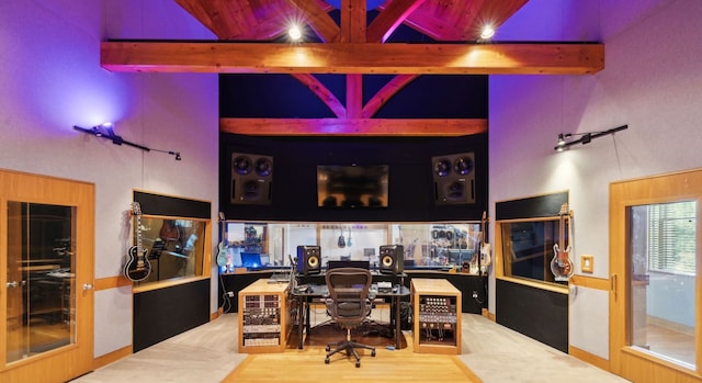 office featuring beam ceiling, high vaulted ceiling, and wood-type flooring