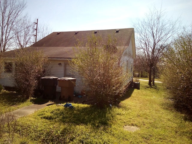 view of home's exterior featuring a lawn