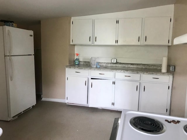 kitchen featuring light stone countertops, white appliances, and white cabinetry