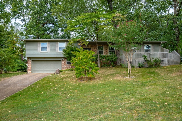 view of front of property with a garage and a front lawn