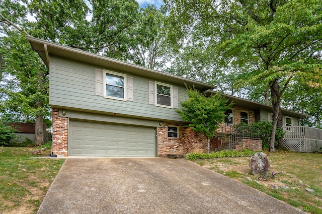 view of front of property with a garage and a front lawn