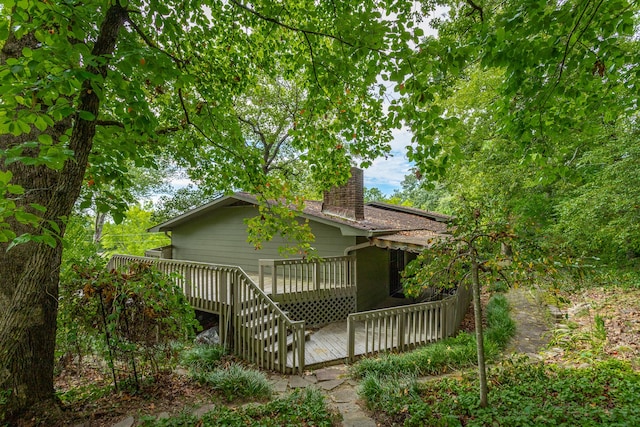 back of house with a wooden deck