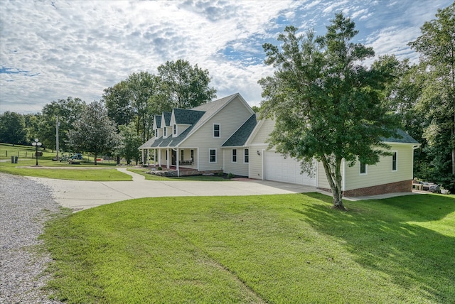 view of front of home with a garage and a front yard