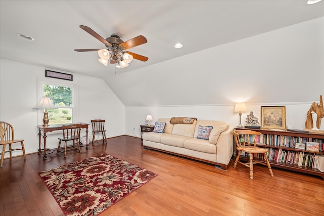 living room featuring lofted ceiling, wood-type flooring, and ceiling fan