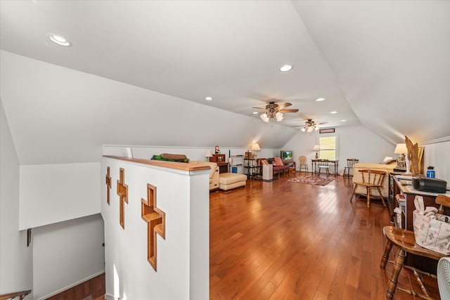 additional living space featuring lofted ceiling, hardwood / wood-style floors, and ceiling fan