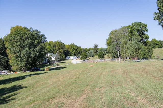 view of yard with a rural view