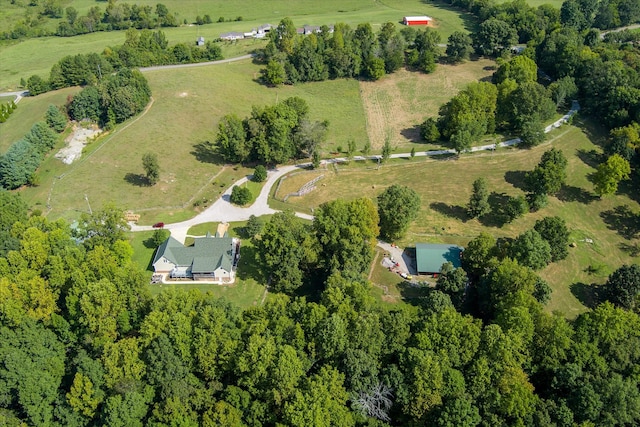 birds eye view of property with a rural view