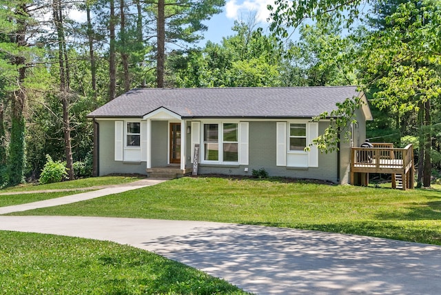 ranch-style home with a front yard