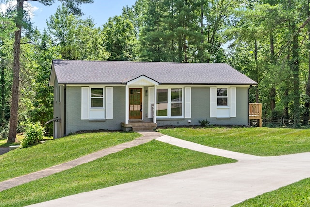 ranch-style house with a front yard