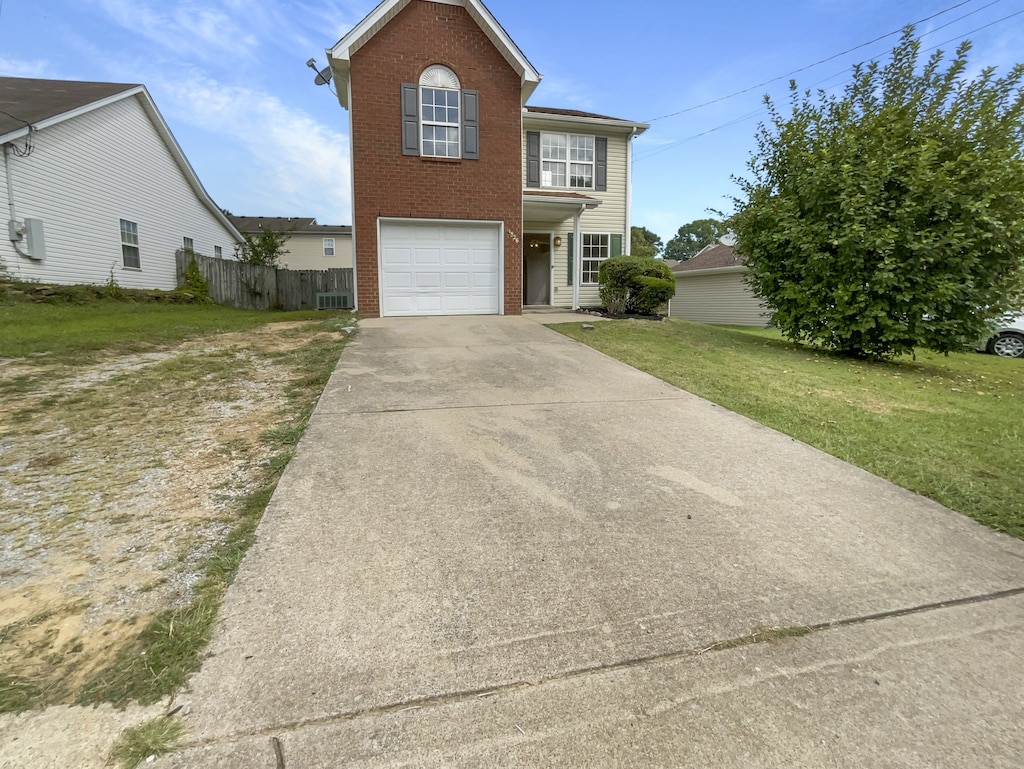 view of front of home with a garage and a front yard