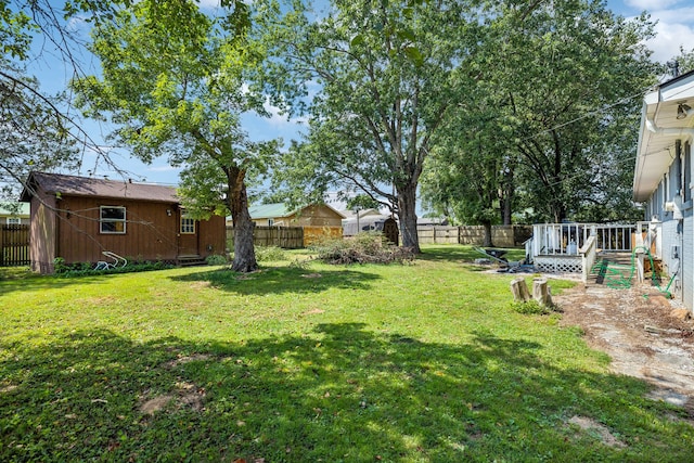 view of yard featuring a wooden deck