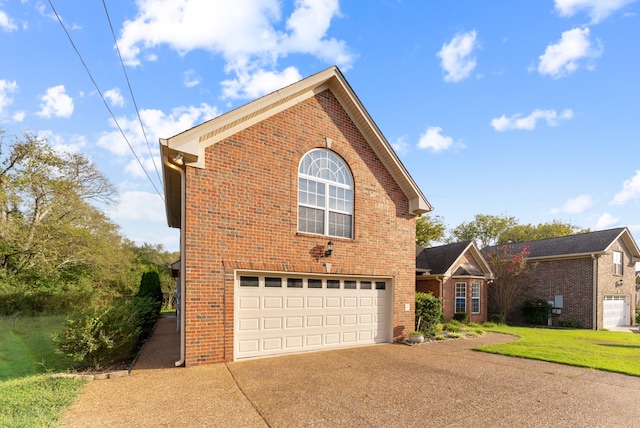 view of side of home featuring a garage