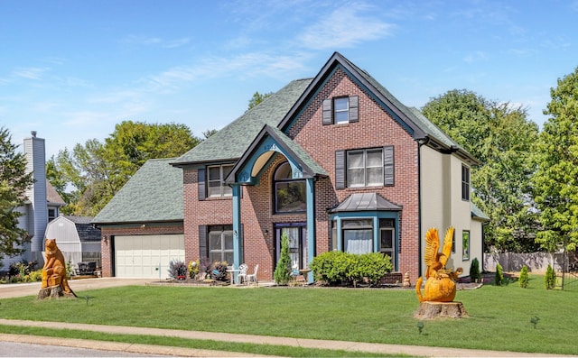 view of front of house with a front lawn and a garage