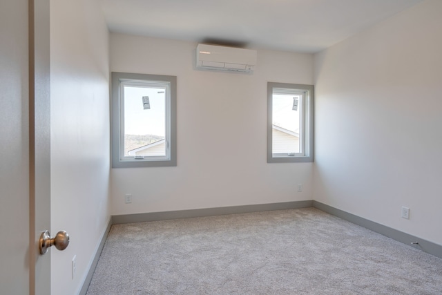 carpeted empty room featuring a wall unit AC