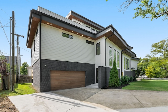 view of property exterior with a lawn and a garage