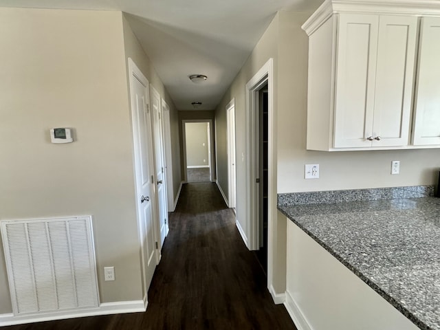 hall with dark hardwood / wood-style floors