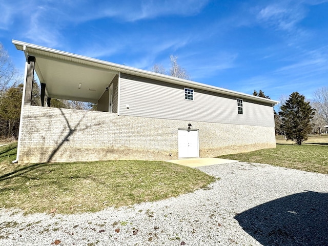 view of property exterior with a lawn