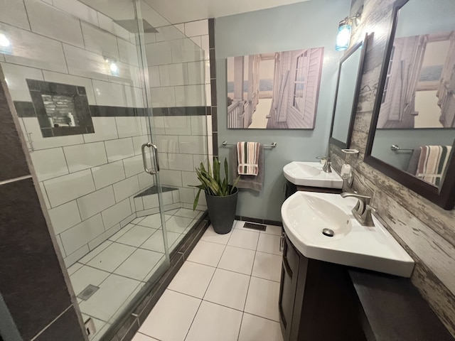 bathroom with vanity, tile patterned floors, and walk in shower