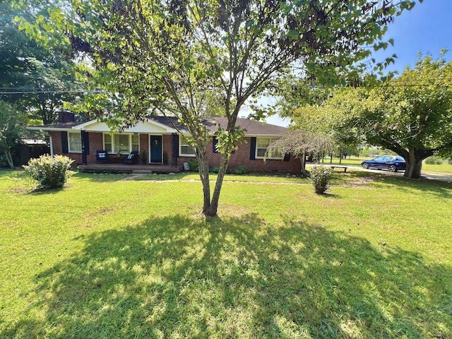 view of yard with covered porch