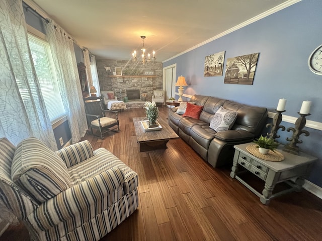 living room with a fireplace, crown molding, dark hardwood / wood-style flooring, and a chandelier