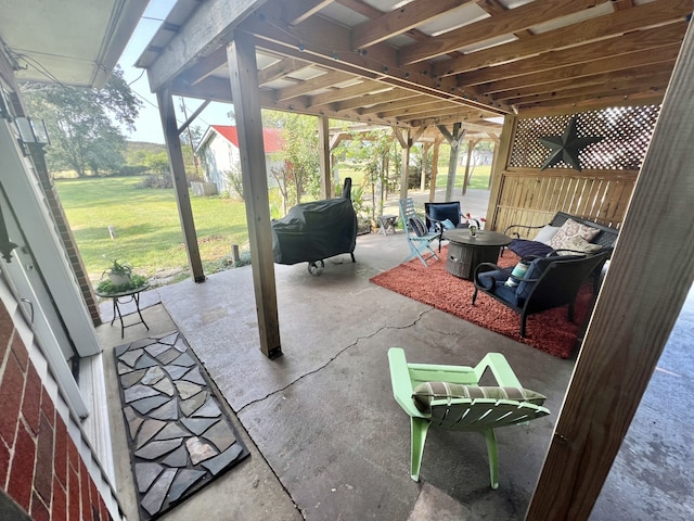 view of patio with a pergola and a grill