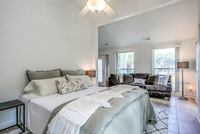 bedroom with ceiling fan and light tile patterned floors